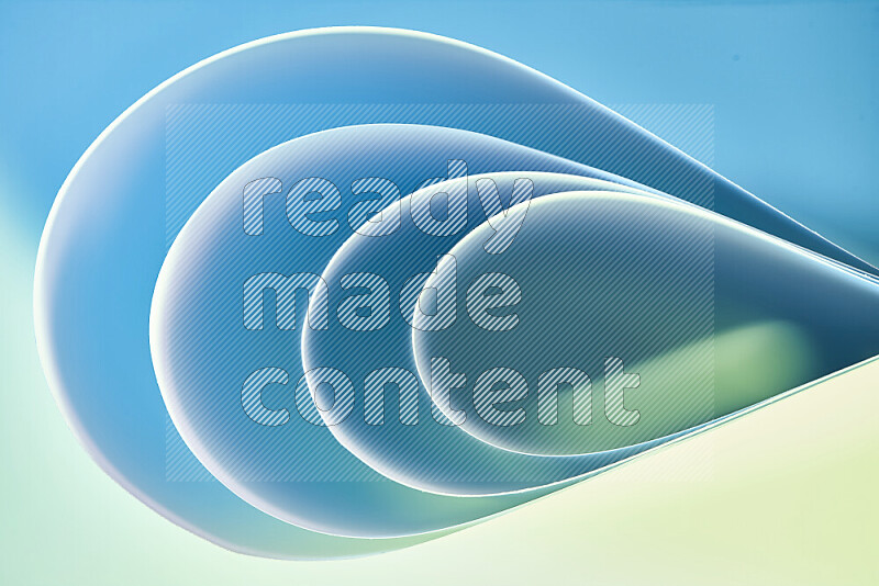 An abstract art of paper folded into smooth curves in green and blue gradients