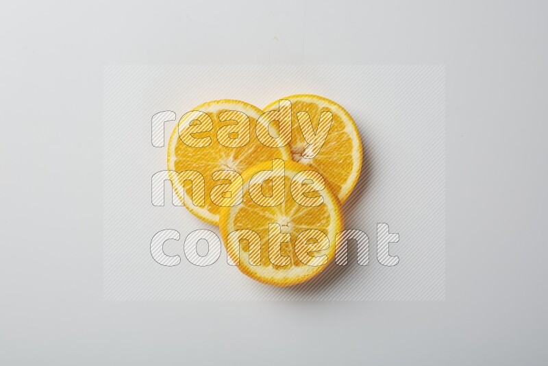 Three orange slices on a white background