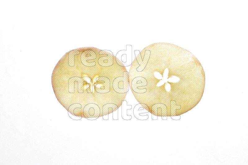 Apple slices on illuminated white background