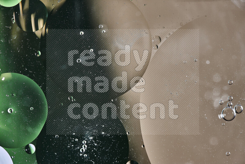 Close-ups of abstract oil bubbles on water surface in shades of green and brown