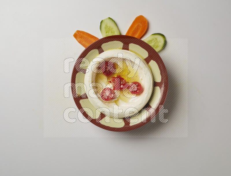 Lebnah garnished with Cherry tomato in a traditional plate on a white background