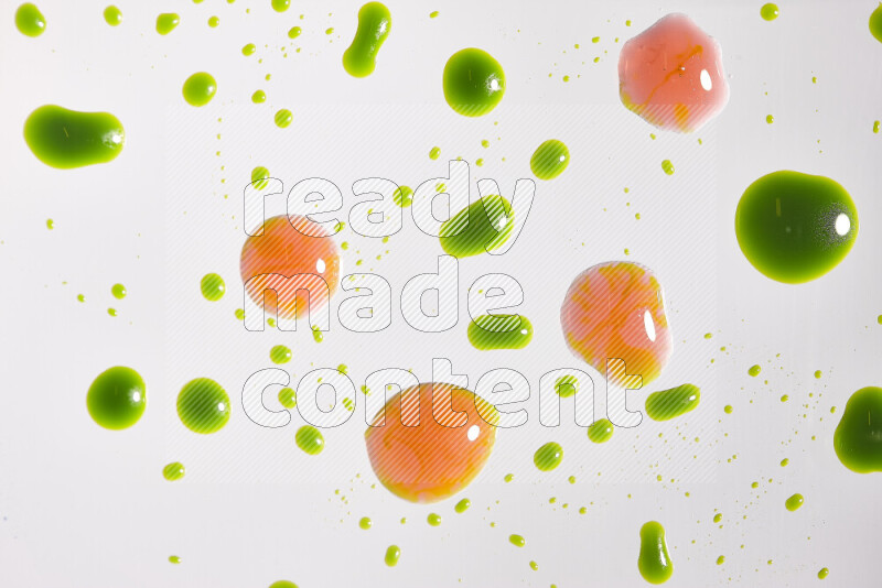 Close-ups of abstract red and green paint droplets on the surface