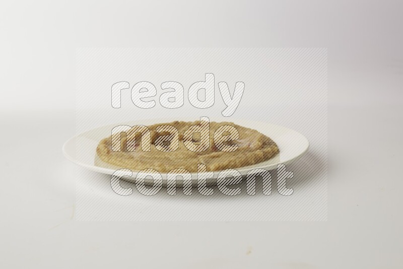 fava bean in a white plate direct on a white background