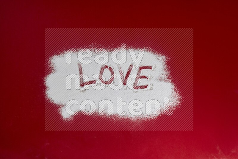 A word written with powder on red background