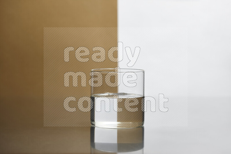 The image features a clear glassware filled with water, set against white and beige background