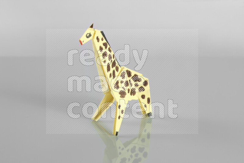 Origami animals on grey background