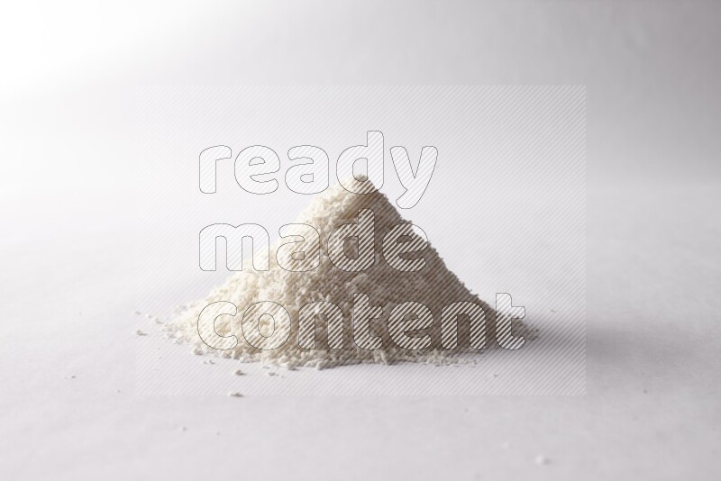 Desiccated coconuts on white background