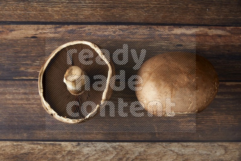 Fresh portobello mushroom topview on a wooden textured background