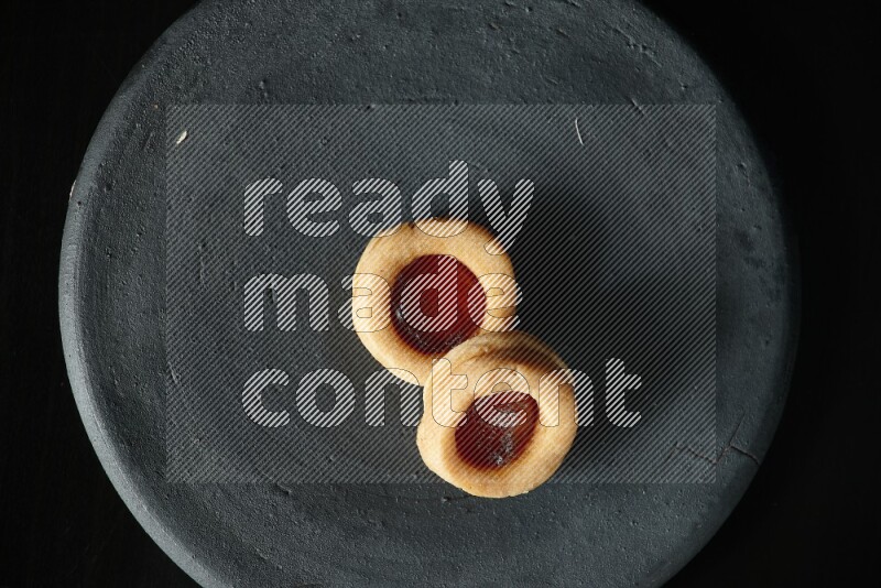 Jam cookies on a black background