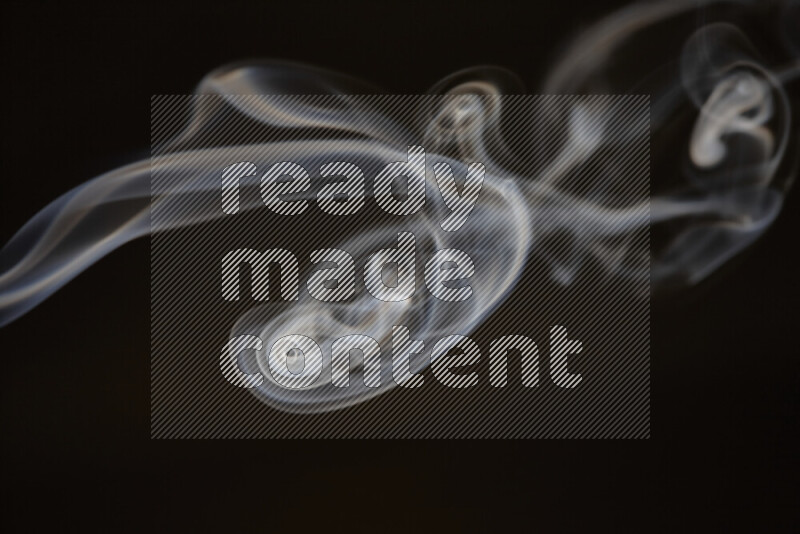 Motion of wavy smoke isolated on dark background