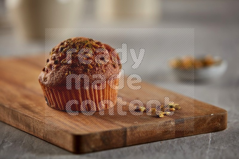 Pistachio cupcake on a wooden board