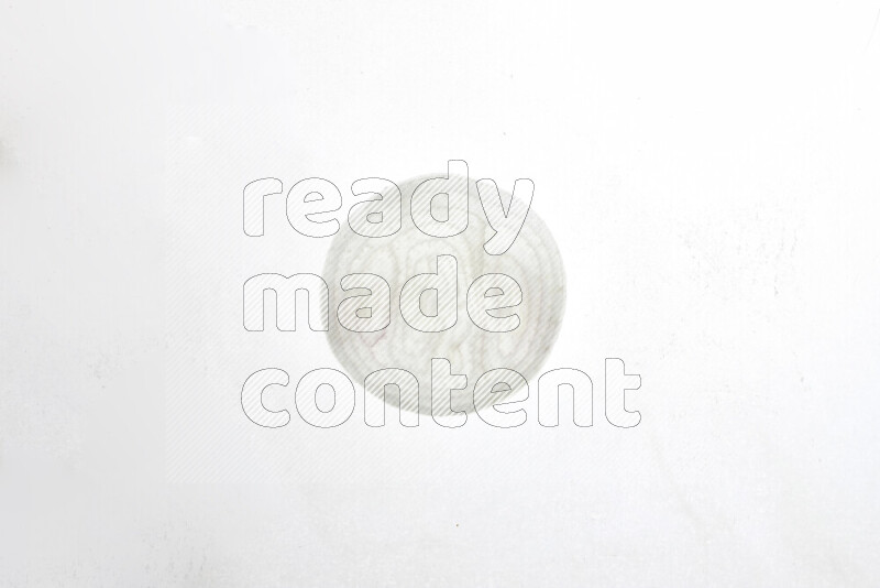 Onion slices on illuminated white background