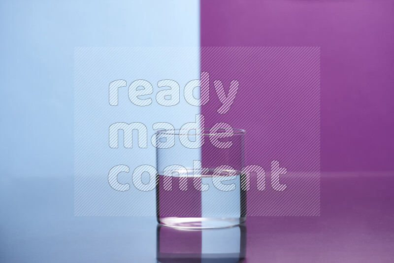 The image features a clear glassware filled with water, set against light blue and purple background