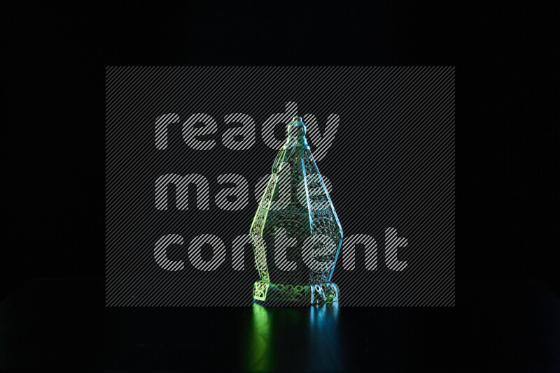 Ramadan lanterns with colored rim light against black background