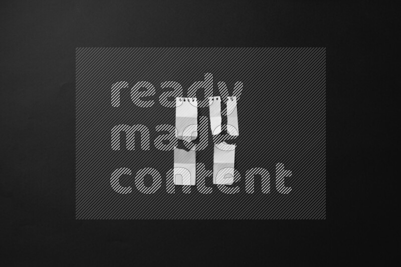 Ripped notebook sheet on black background