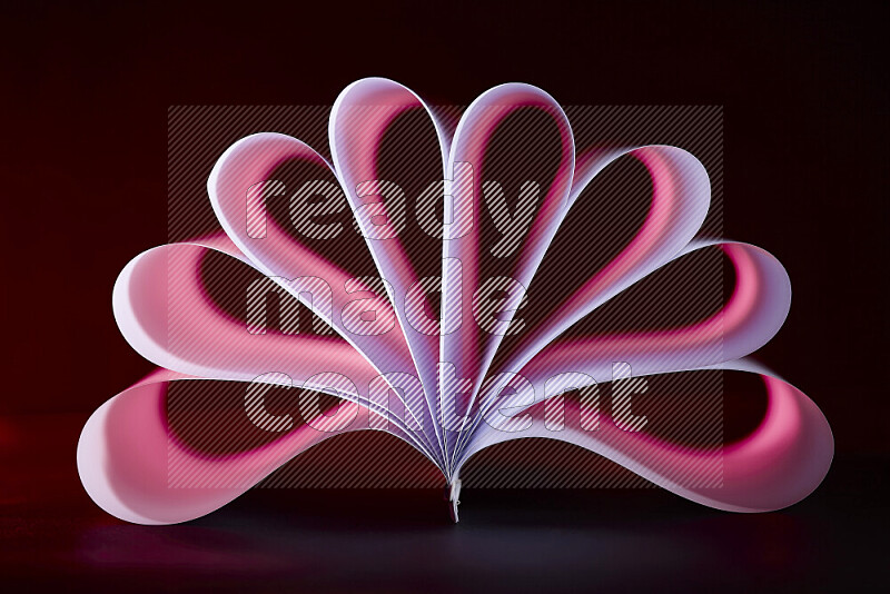 An abstract art piece displaying smooth curves in pink and purple gradients created by colored light