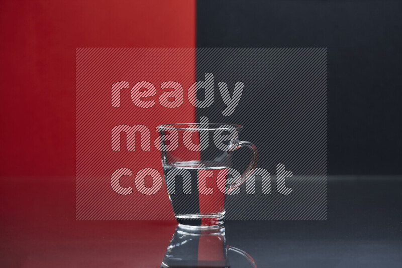 The image features a clear glassware filled with water, set against red and black background