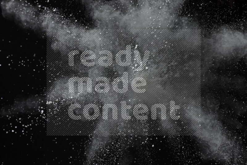 White powder explosion on black background