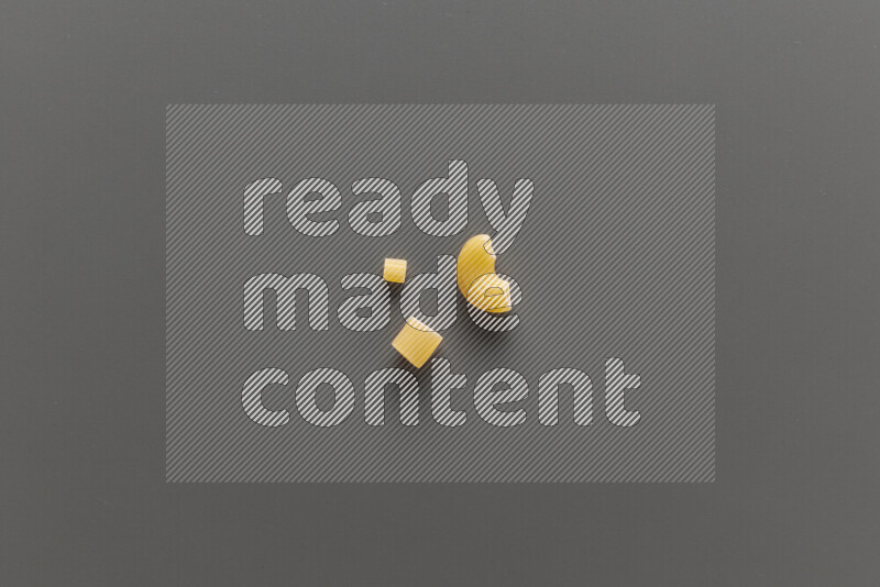 Different pasta types on grey background