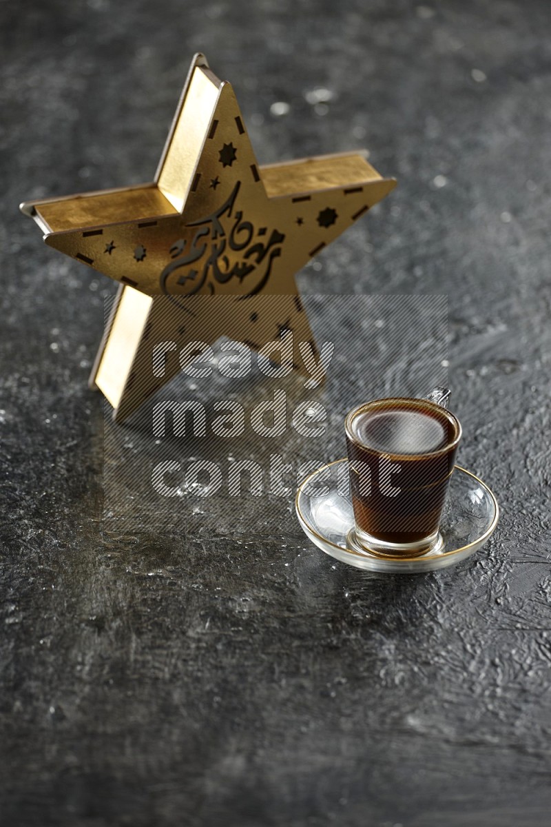 A star lantern with drinks, dates, nuts, prayer beads and quran on textured black background