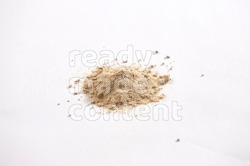 Garlic powder on a white flooring in different angles