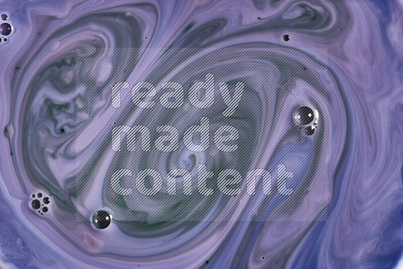 A close-up of abstract swirling patterns in blue, pink and green