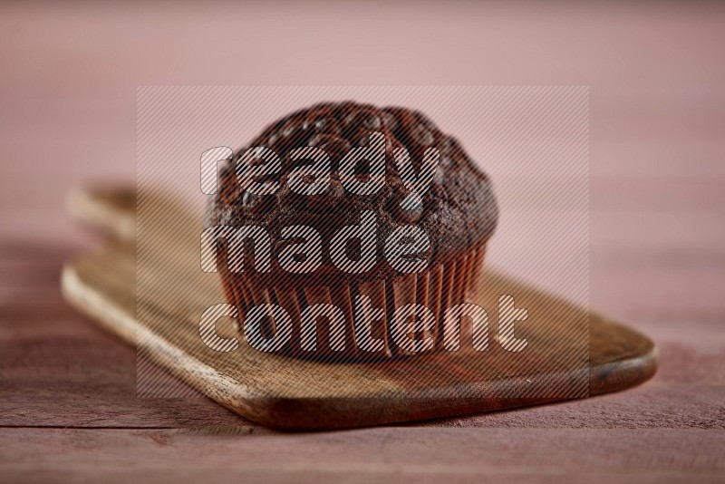 Chocolate cupcake on a wooden board