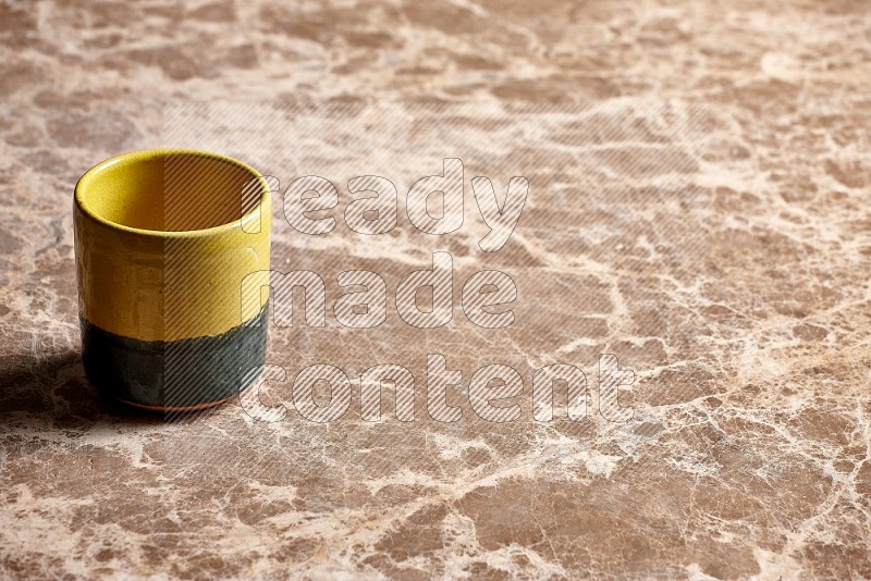 Multicolored Pottery Cup on Beige Marble Flooring, 45 degrees