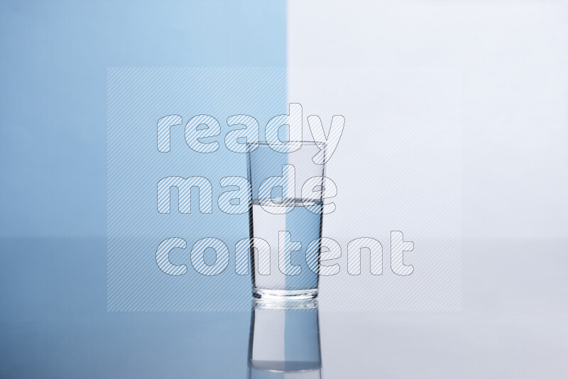 The image features a clear glassware filled with water, set against white and light blue background