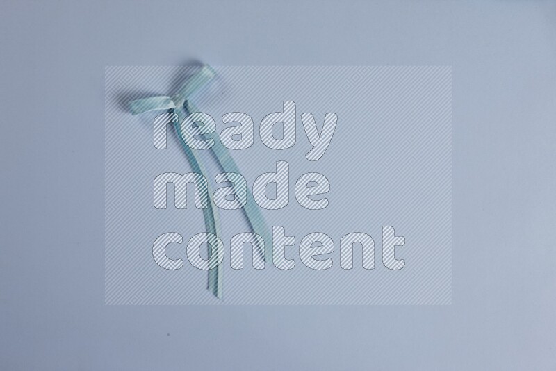 A blue collection of sewing and tailoring tools arranged on a blue background