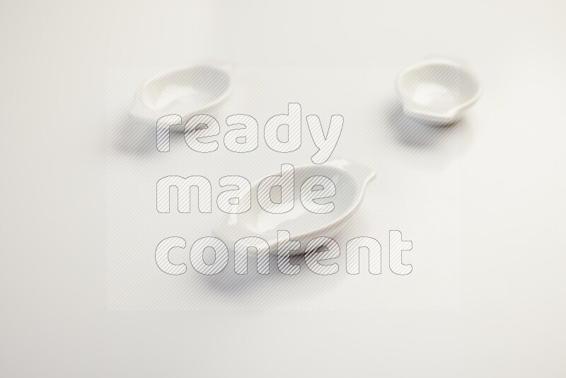 white ceramic oval sauce dish on white countertop