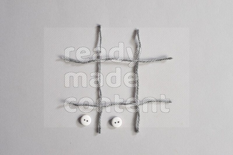 White buttons placed on grey background