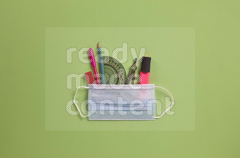 School supplies on green background (Back to school)