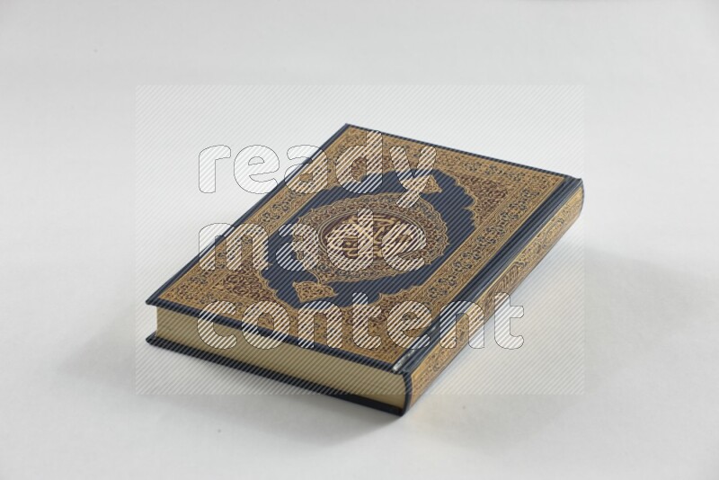Quran with a prayer beads on white background