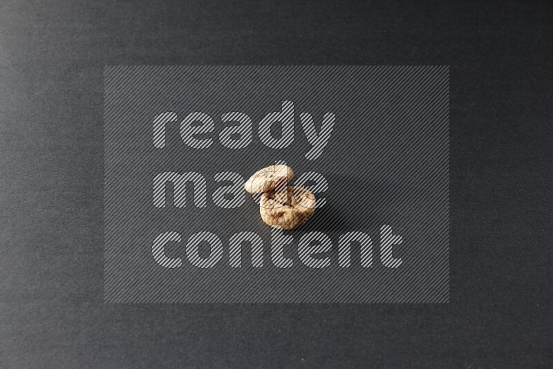 Two dried figs on a black background in different angles