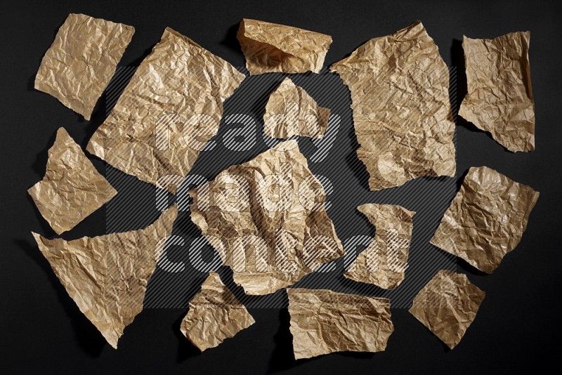 Crumpled craft paper on black background