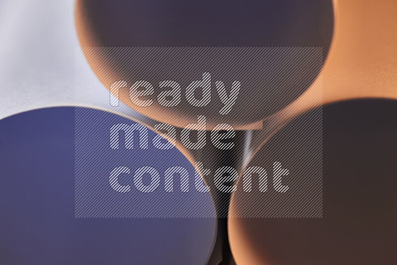 The image shows an abstract paper art with circular shapes in varying shades of grey and warm tones