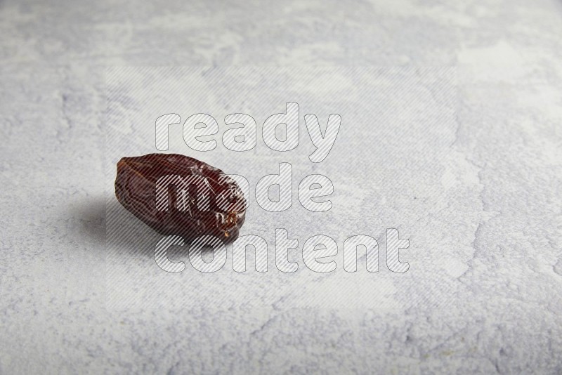 one madjoul date on a light grey background