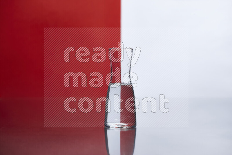 The image features a clear glassware filled with water, set against white and red background