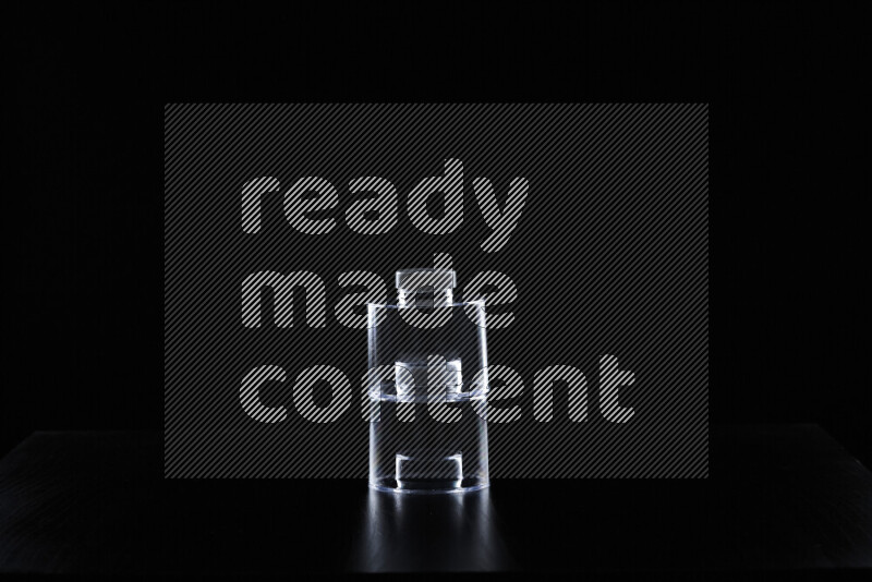 Glassware with rim light against black background