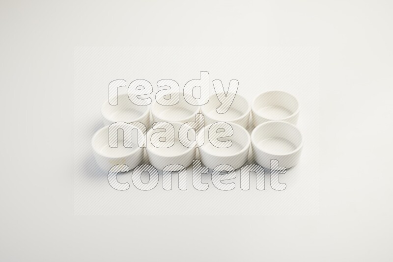 white ceramic round sauce dish on white countertop