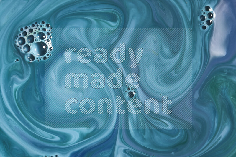 A close-up of abstract swirling patterns in blue and green