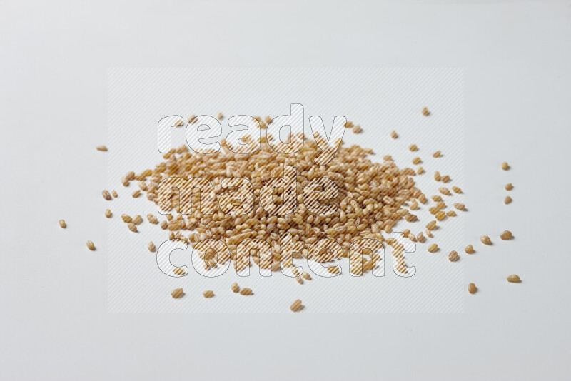 Hulled wheat on white background