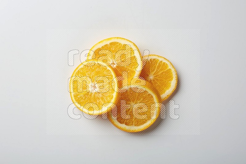 Four orange slices on a white background