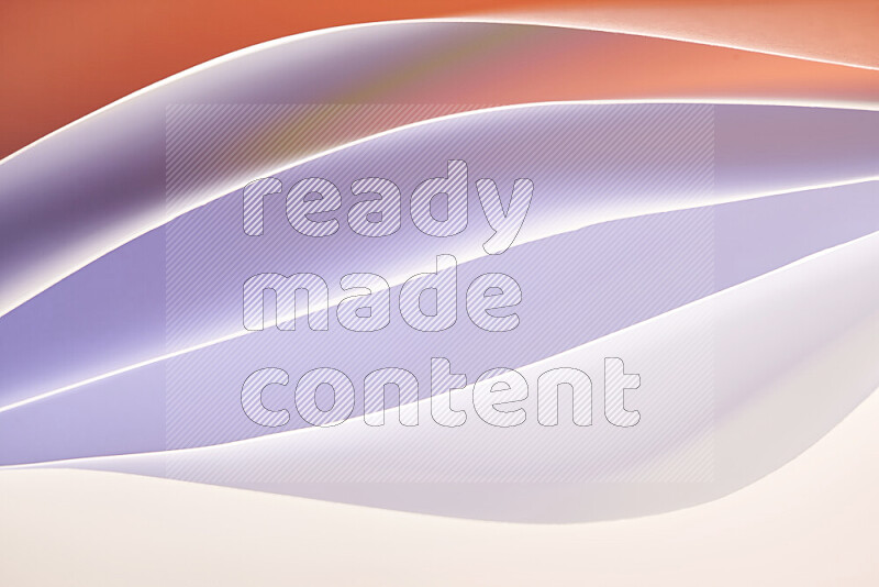 This image showcases an abstract paper art composition with paper curves in white and different warm gradients created by colored light