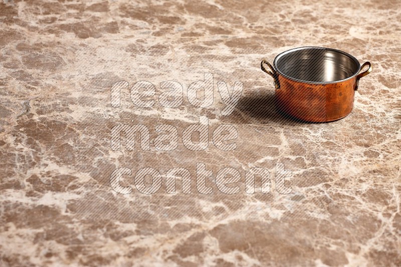 Small Copper Pot on Beige Marble Flooring, 45 degrees