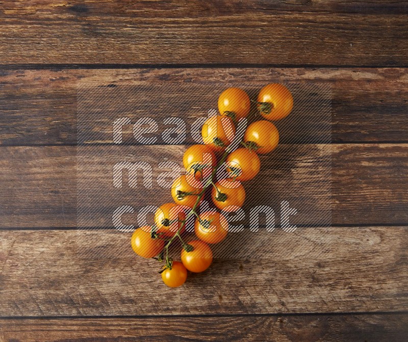 Single cherry tomato vein topview on a wooden background