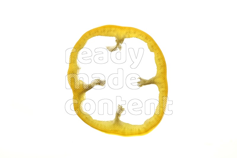 Yellow bell pepper slices on illuminated white background