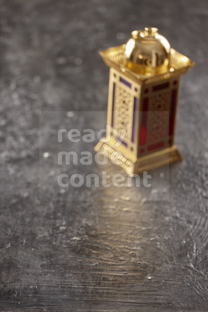 An out of focus lantern on textured black background