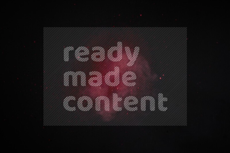 Red powder explosion on black background